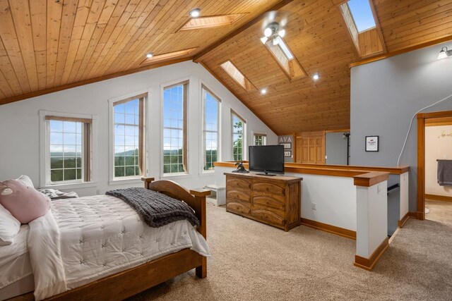 bedroom with light carpet, baseboards, lofted ceiling with skylight, recessed lighting, and wooden ceiling