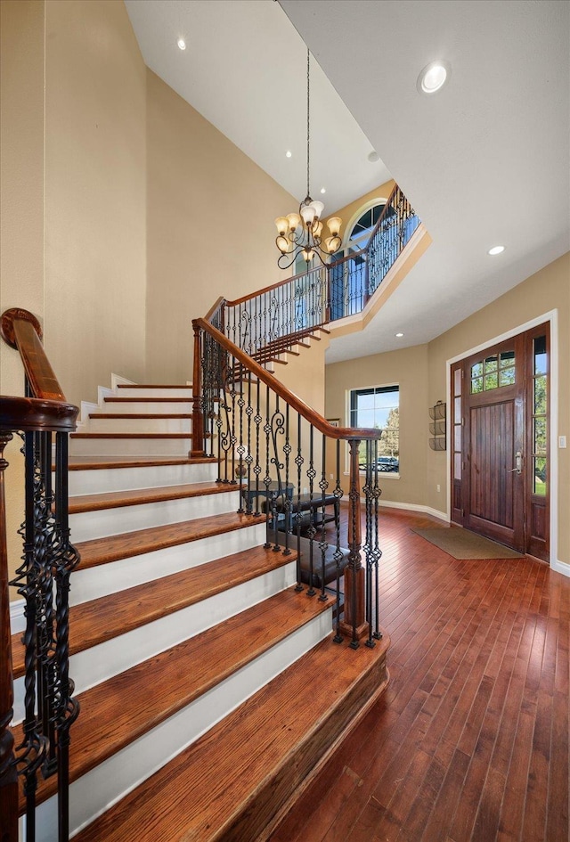 22828 S Gateway Ln, Cheney, WA 99004 - foyer entrance with an inviting chandelier, wood finished floors, baseboards, stairway, and recessed lighting