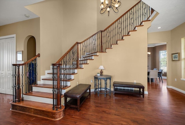 22828 S Gateway Ln, Cheney, WA 99004 - staircase with baseboards, a high ceiling, wood finished floors, and a notable chandelier