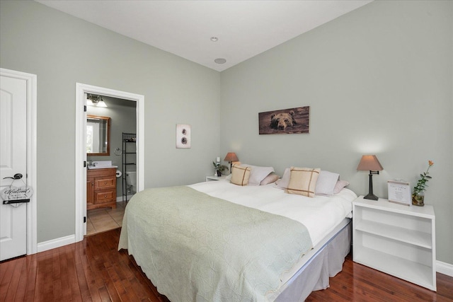 22828 S Gateway Ln, Cheney, WA 99004 - bedroom with baseboards, ensuite bathroom, and hardwood / wood-style flooring