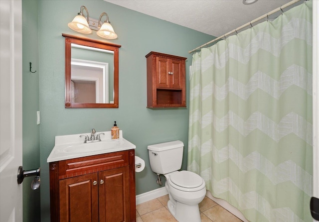 22828 S Gateway Ln, Cheney, WA 99004 - bathroom with a textured ceiling, tile patterned flooring, vanity, baseboards, and toilet
