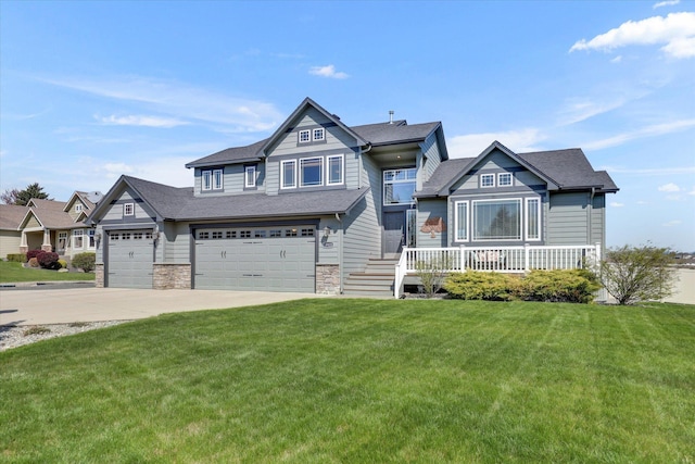 craftsman inspired home with roof with shingles, stone siding, a front yard, and concrete driveway