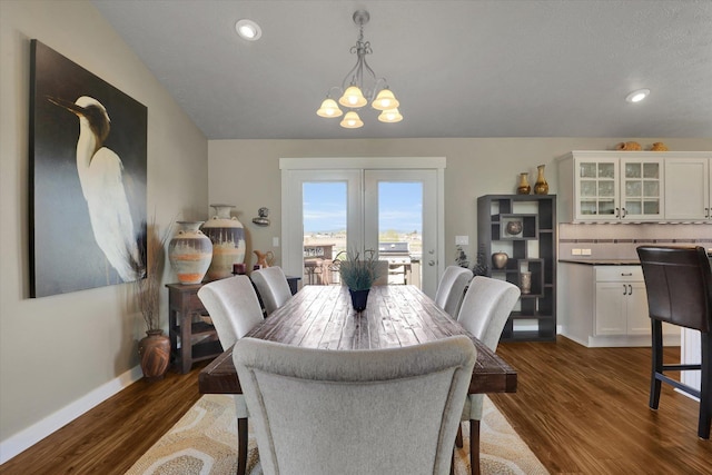 dining room with recessed lighting, baseboards, dark wood-style floors, and a notable chandelier