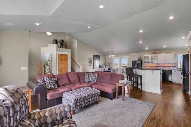 living room featuring a notable chandelier, stairs, recessed lighting, lofted ceiling, and dark wood-style floors