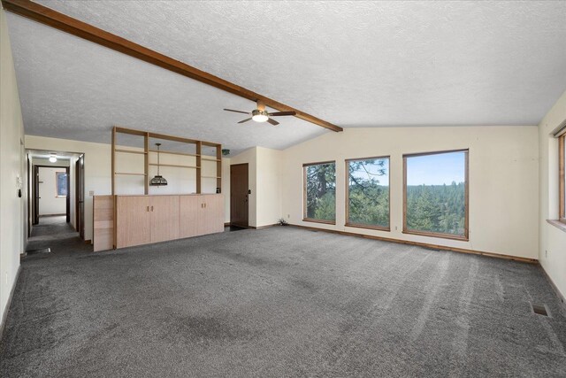unfurnished living room with carpet floors, vaulted ceiling with beams, baseboards, and a ceiling fan