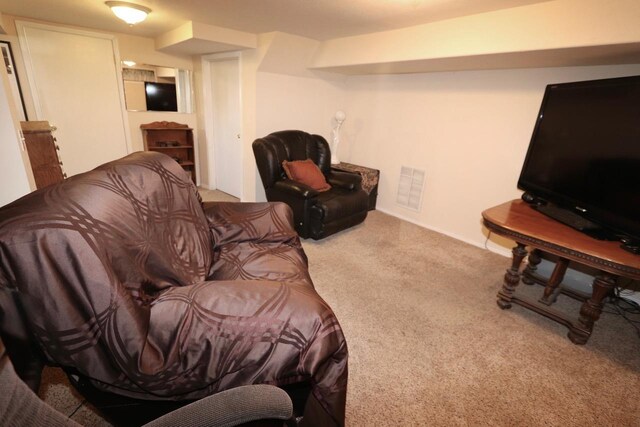 living area with carpet floors and visible vents