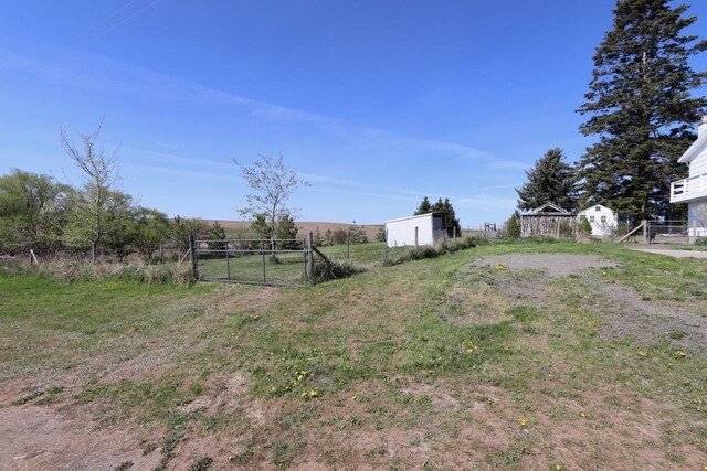 view of yard with a gate and fence