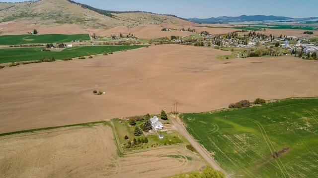 aerial view with a mountain view and a rural view
