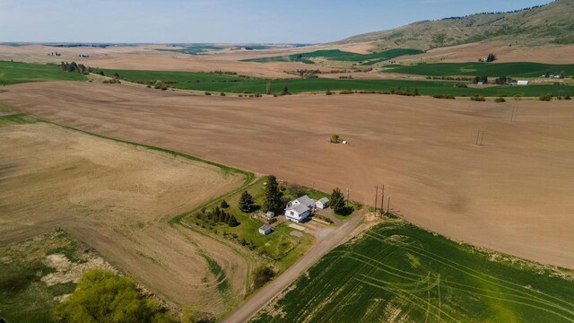 aerial view featuring a rural view and a mountain view