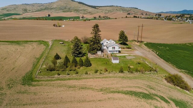 bird's eye view featuring a mountain view and a rural view