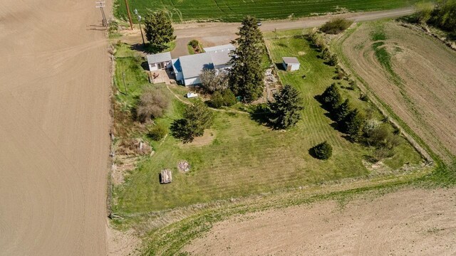 birds eye view of property with a rural view