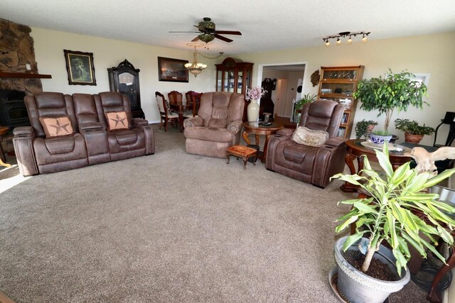 living room with a ceiling fan and carpet