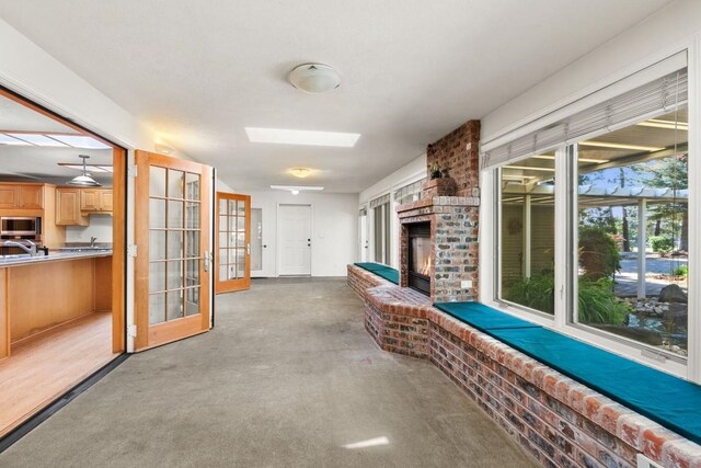 interior space featuring carpet floors and a sink