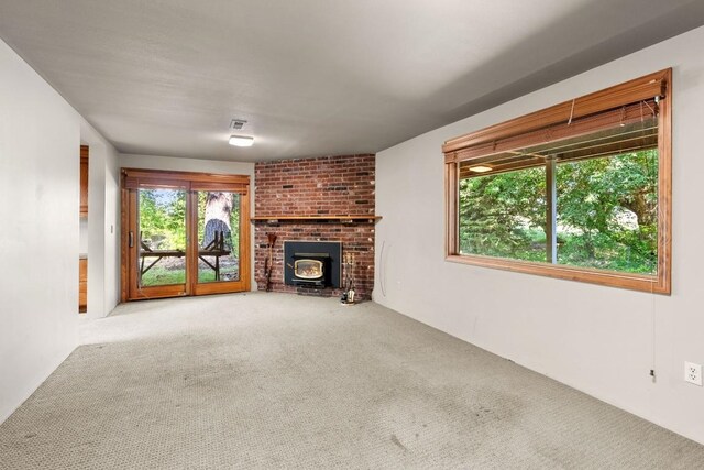 unfurnished living room featuring carpet floors
