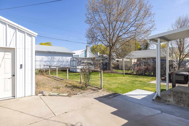 view of yard with fence and a patio