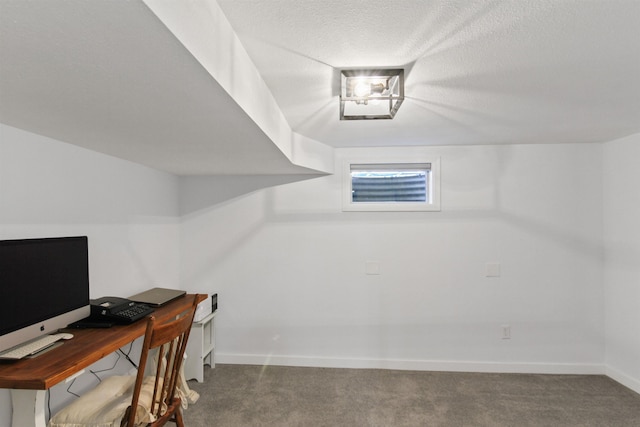office featuring baseboards, a textured ceiling, and carpet