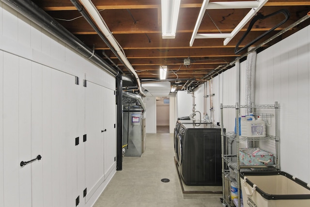 basement with washer and clothes dryer