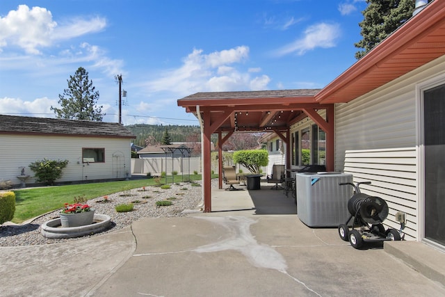 view of patio / terrace with fence and central AC