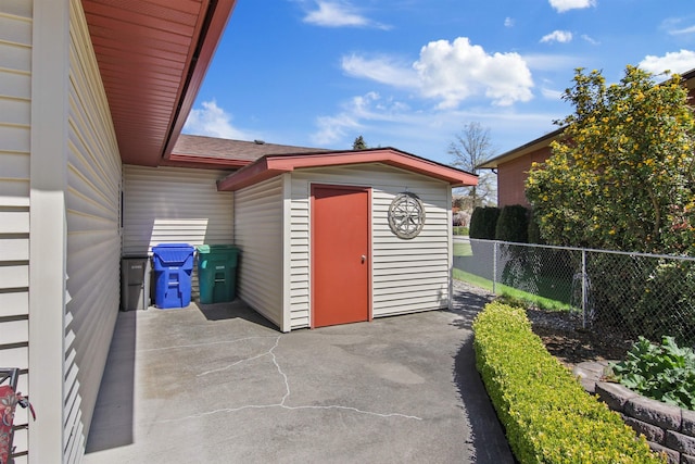 view of shed with fence