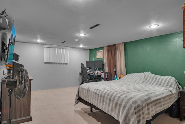 bedroom with carpet floors, recessed lighting, and visible vents