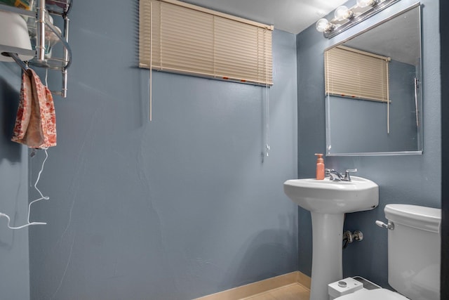 half bathroom with toilet