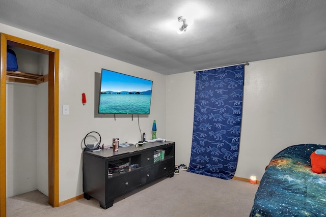bedroom with carpet flooring and baseboards