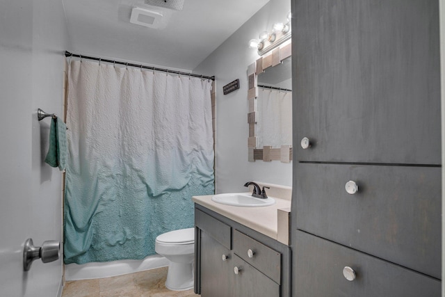 bathroom with vanity, tile patterned flooring, and toilet