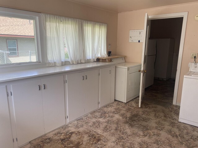 interior space featuring washer / dryer and cabinet space