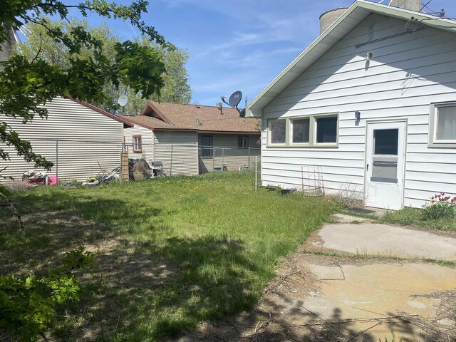 back of house featuring a chimney