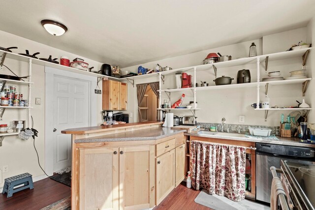 kitchen with open shelves, wood finished floors, a sink, light countertops, and light brown cabinets