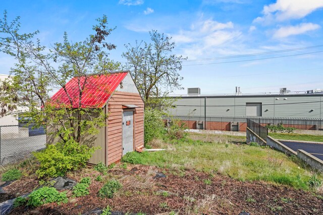 view of shed with fence