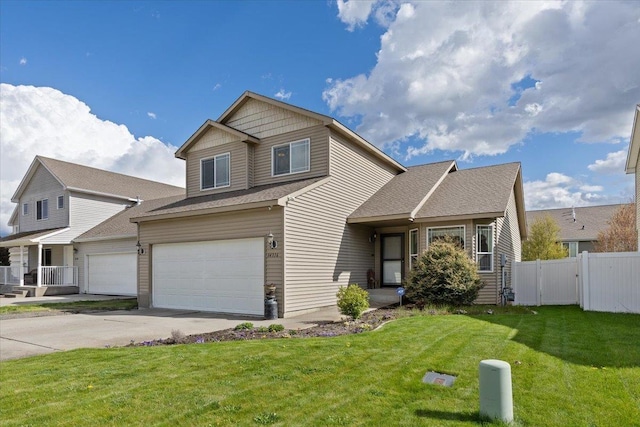 14316 E 31st Ln, Veradale, WA 99037 - traditional home with an attached garage, fence, driveway, and a front yard