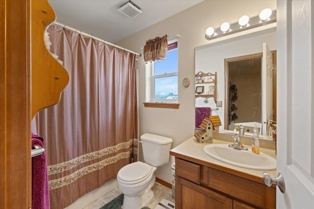 14316 E 31st Ln, Veradale, WA 99037 - bathroom with toilet, a shower with curtain, visible vents, and vanity