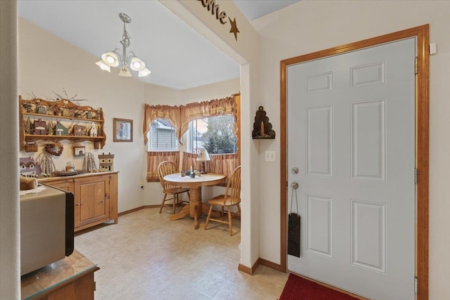 14316 E 31st Ln, Veradale, WA 99037 - foyer featuring baseboards, light floors, and a chandelier