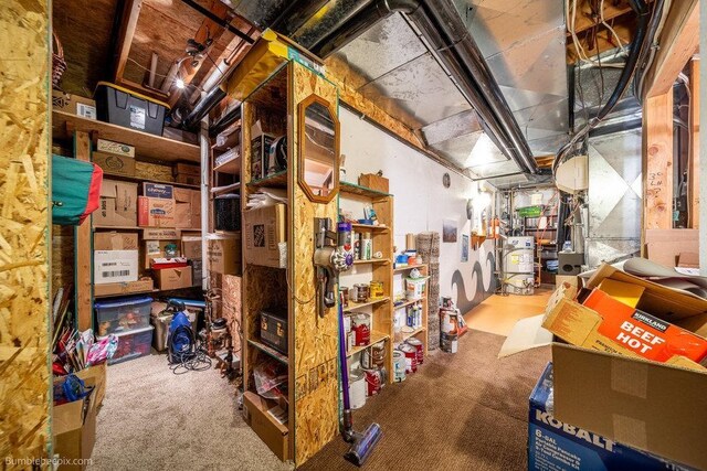 storage room featuring water heater