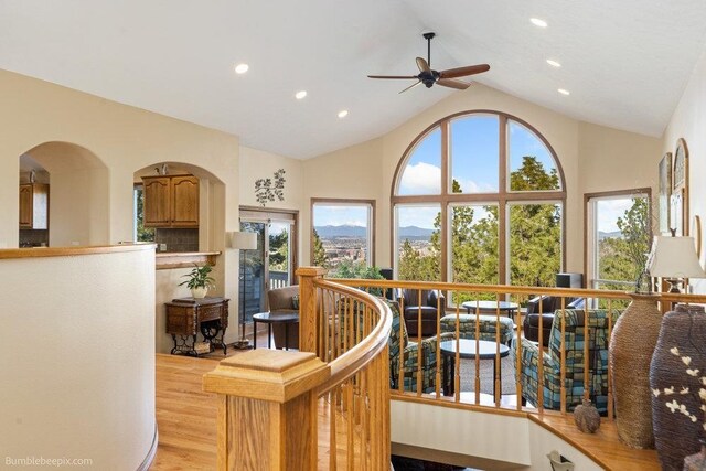 living room with light wood-style floors, recessed lighting, ceiling fan, and a wealth of natural light