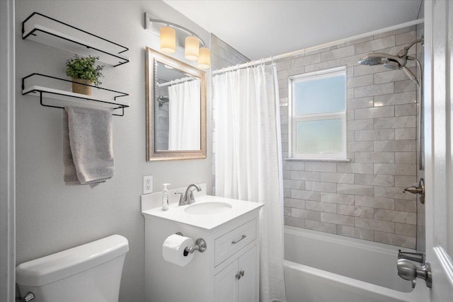 full bathroom featuring vanity, shower / bath combo with shower curtain, and toilet