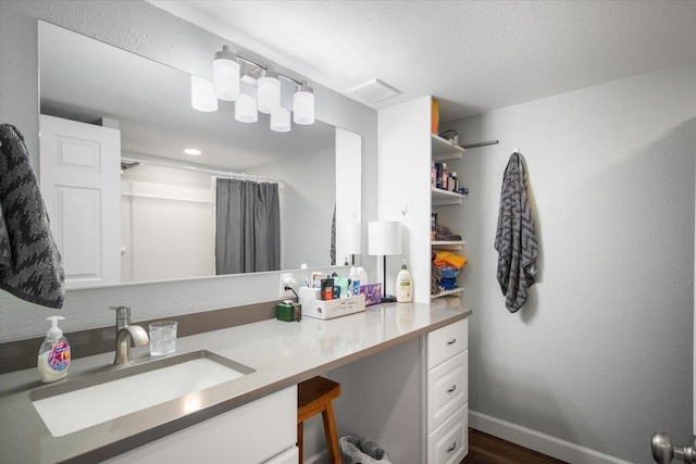 full bath with visible vents, curtained shower, wood finished floors, vanity, and baseboards