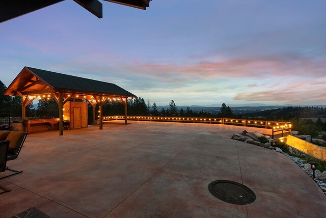 view of patio featuring a gazebo and a mountain view