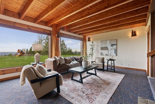 interior space featuring wood ceiling, baseboards, and beam ceiling