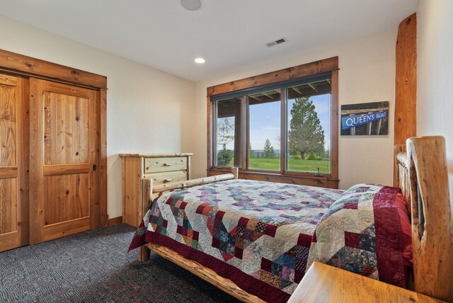 carpeted bedroom with visible vents and recessed lighting