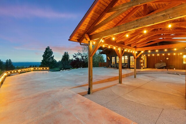 view of patio terrace at dusk