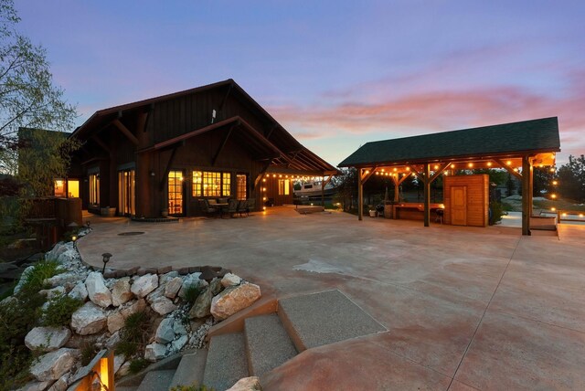 rear view of property featuring a patio and a gazebo