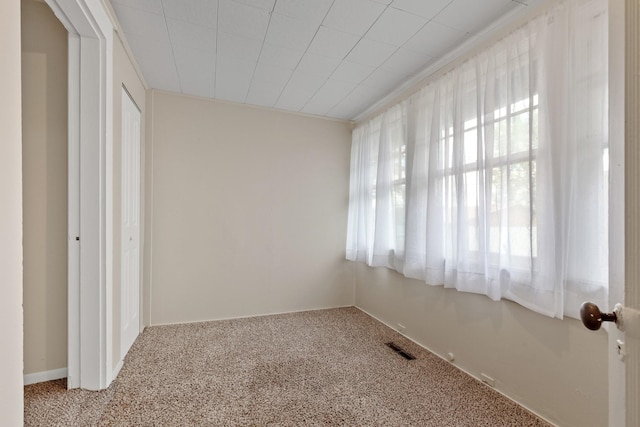 unfurnished bedroom with visible vents and carpet floors