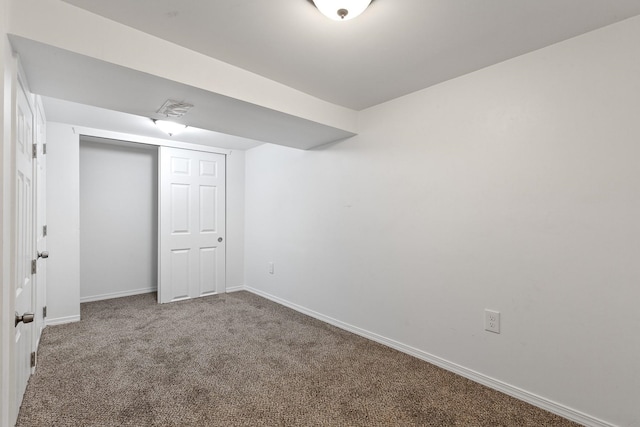 interior space featuring carpet floors and baseboards