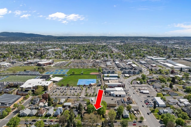 birds eye view of property with a mountain view