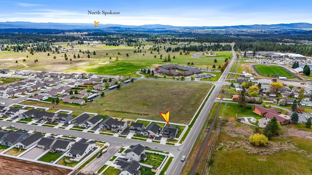 drone / aerial view with a residential view and a mountain view