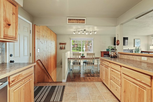 kitchen featuring visible vents, light brown cabinetry, and light tile patterned flooring
