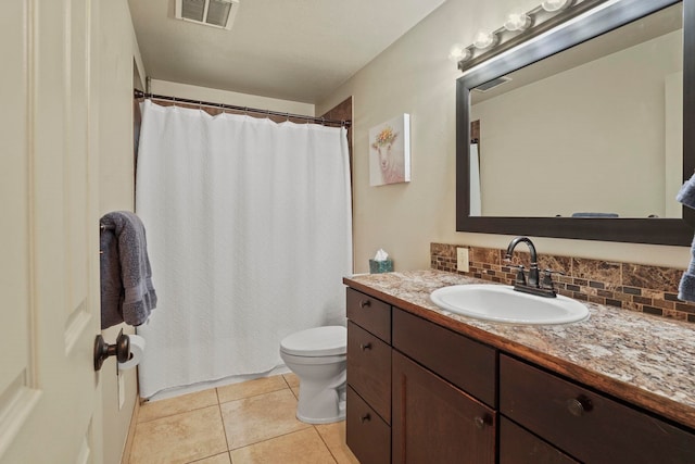 bathroom featuring vanity, toilet, tile patterned floors, tasteful backsplash, and visible vents