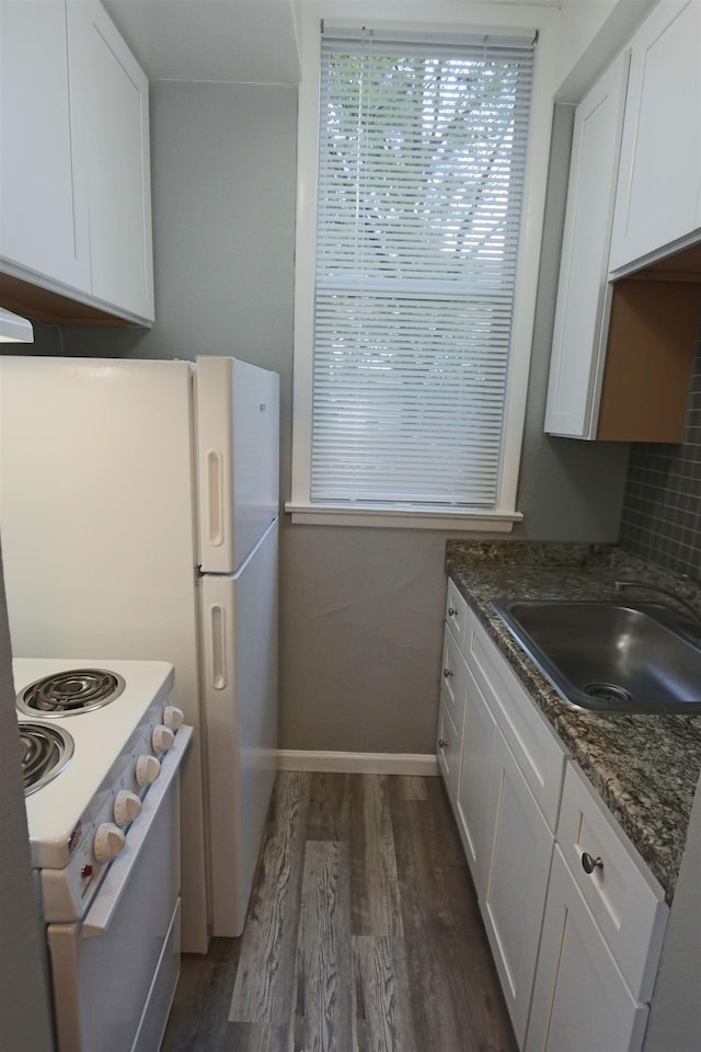 kitchen featuring white cabinets, a sink, dark wood-type flooring, and white electric range